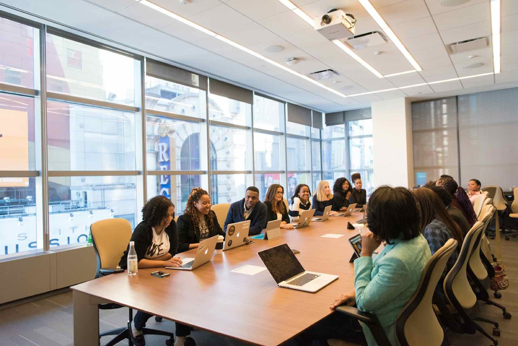 Team meeting around a full boardroom table