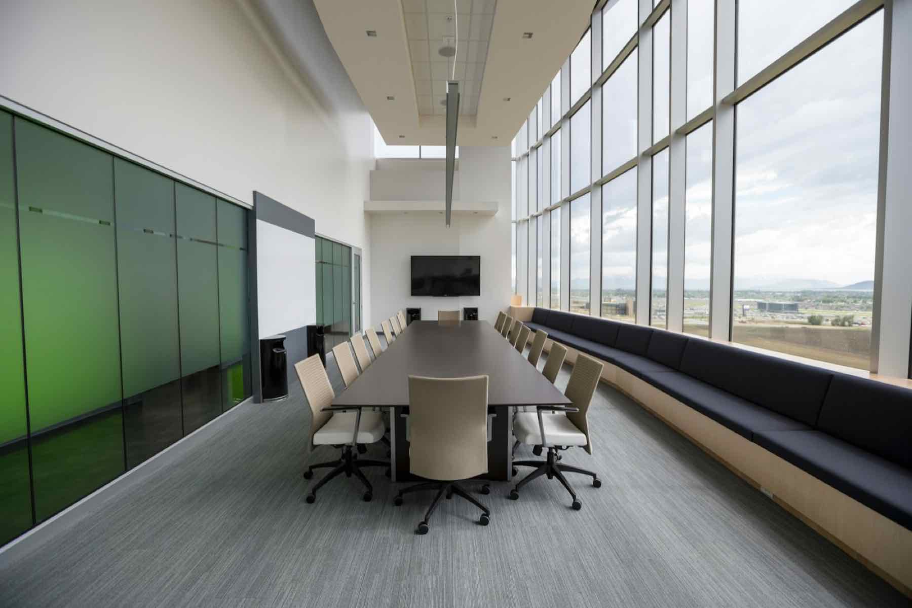 Modern boardroom with wall display for video conferencing