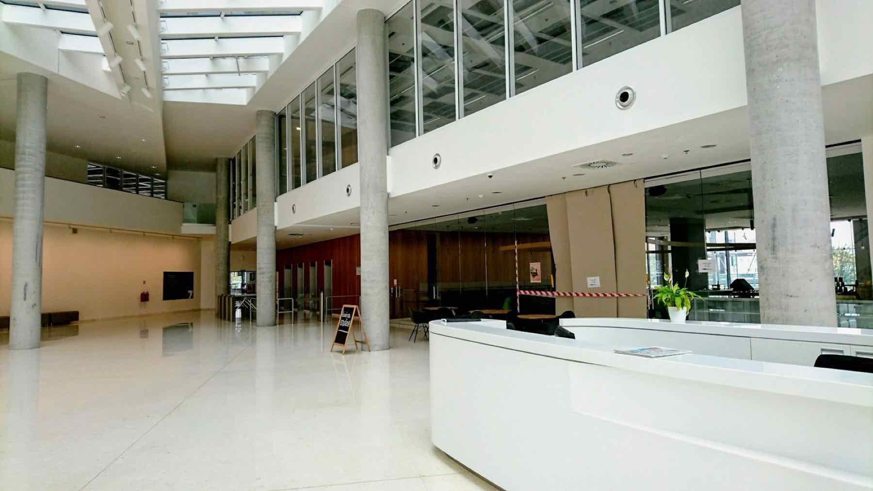 Bright modern reception desk in atrium lobby