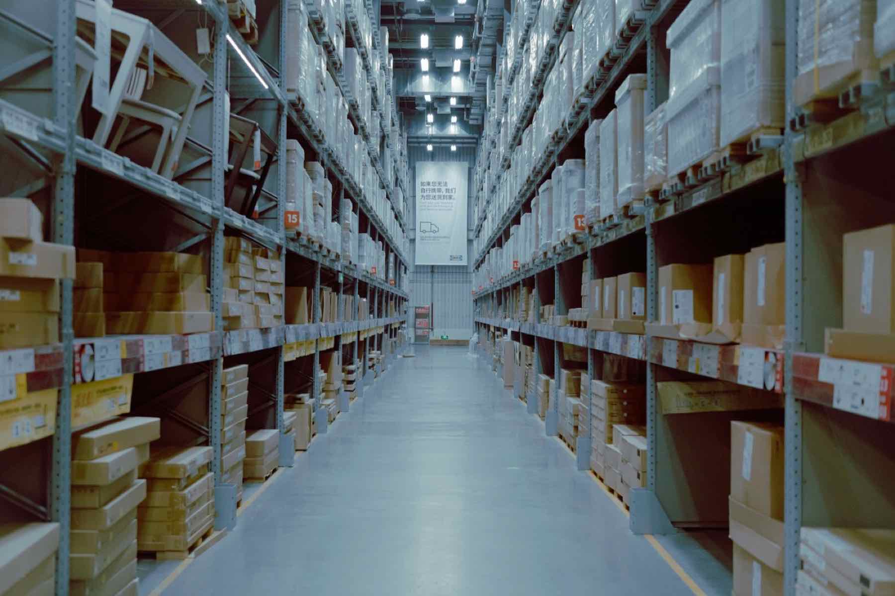 Bright warehouse aisle with racking